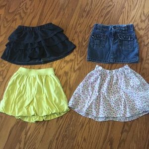 Lot of 4 girl 4T skirts.
